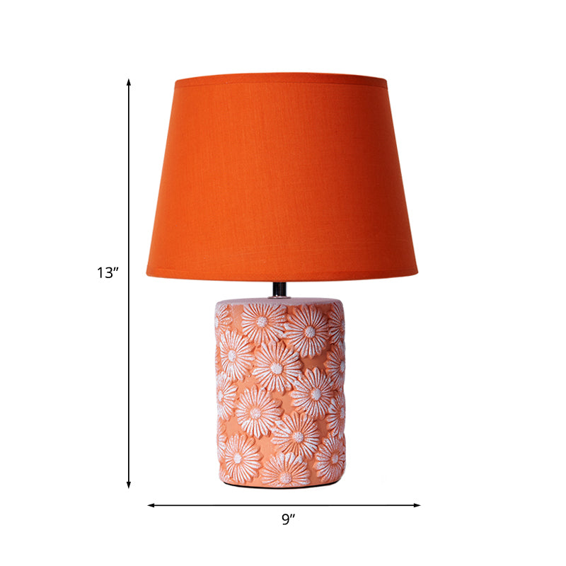 GloeiLieke – Orangefarbene Flare-Tischlampe mit Sockel mit Sonnenblumenausschnitt