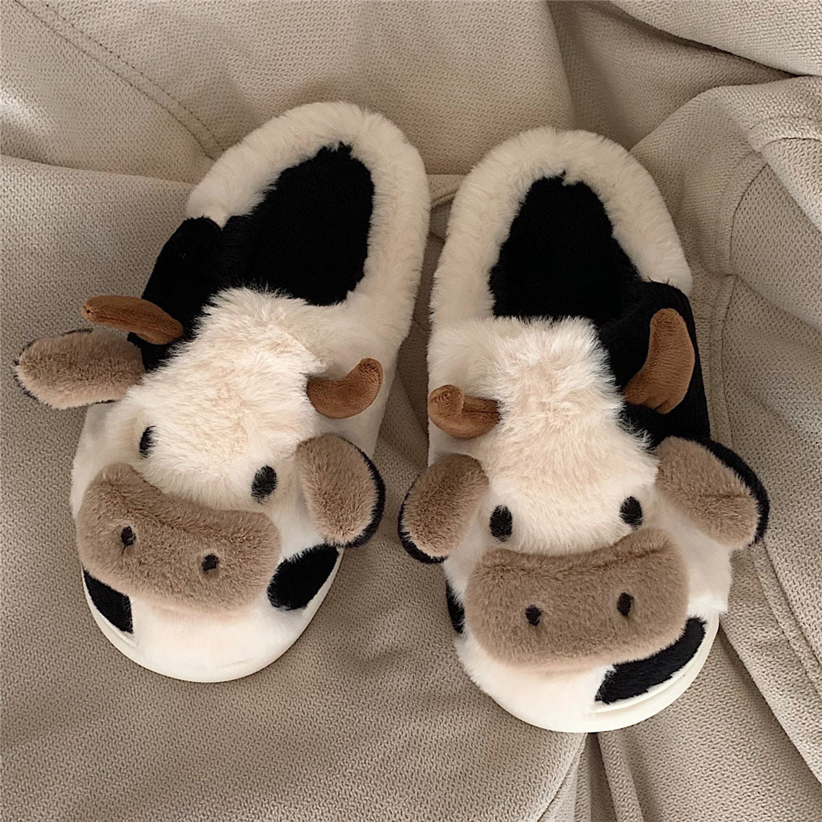 Pantuflas de vaca mullidas