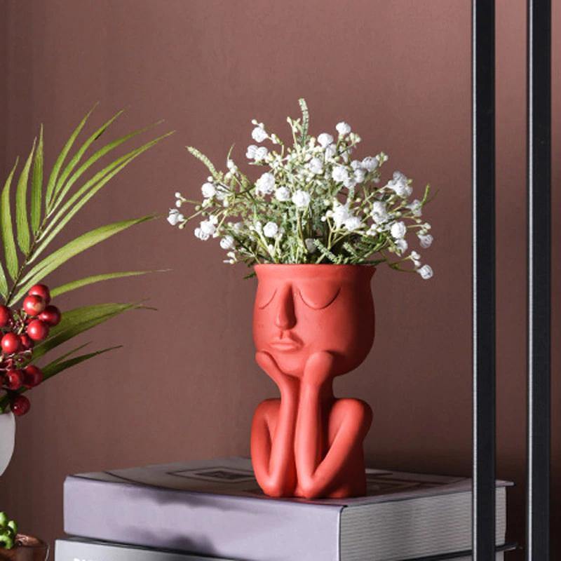 Pot de fleurs en céramique avec ventouses pour le repos du visage