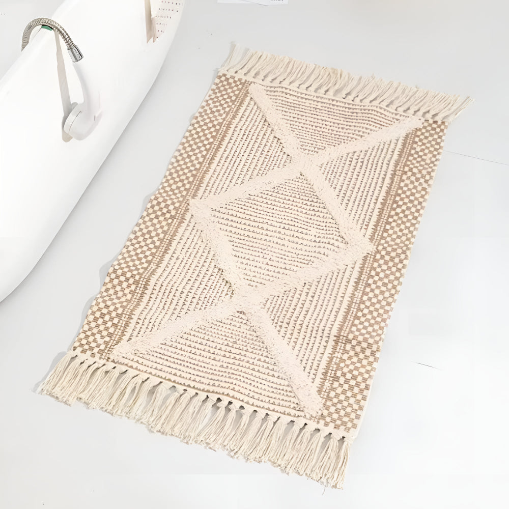 Beige teksturoitu fringe-tupsu matto