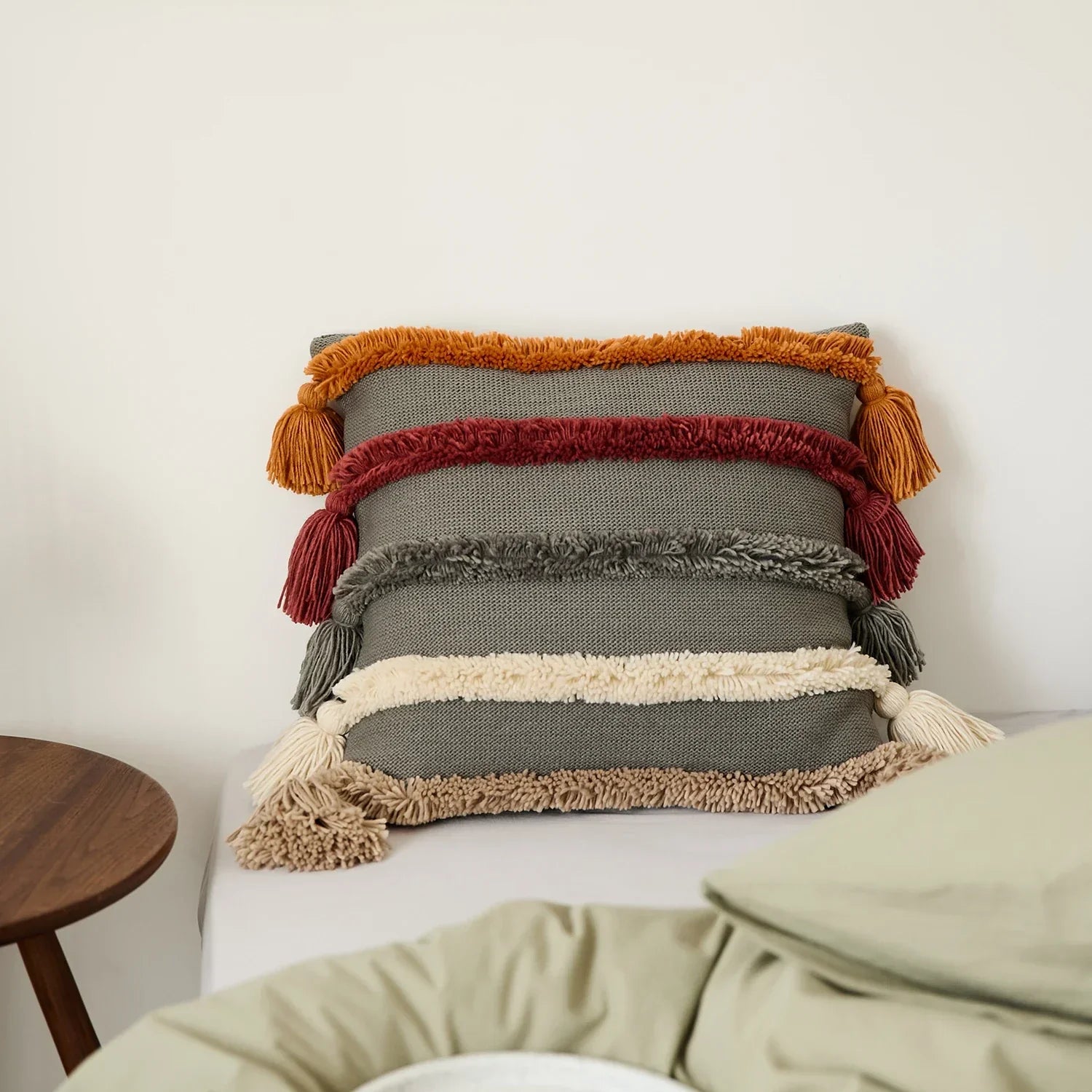 Housse de coussin touffetée style bohème – avec pompons