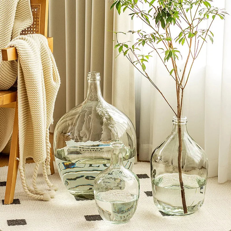 Jarrón de cristal transparente con arreglo de flores, adornos, agua para barriga para plantas verdes