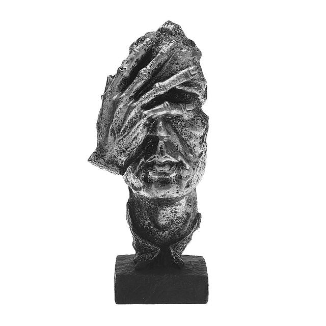 Sculpture des visages d'Odin