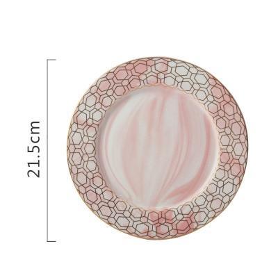 Set di piatti in ceramica marmorizzata a strisce dorate