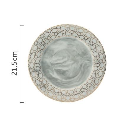 Set di piatti in ceramica marmorizzata a strisce dorate